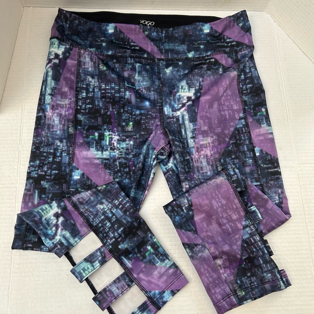 VoGo Athletics leggings. Purple multi colour, leg cutouts.